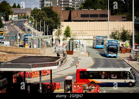 Stockport Wellington Road and the busy 192 bus route and the Merseyway entrance to the bus station and Debenhams Stock Photo