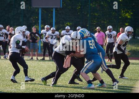 Kiev Ukraine, 15 August 2021, Players in sports uniforms on the field of playing American football. Ukrainian Championship Lvov Lions vs Kiev Capitals Stock Photo