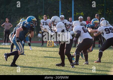 Kiev Ukraine, 15 August 2021, Players in sports uniforms on the field of playing American football. Ukrainian Championship Lvov Lions vs Kiev Capitals Stock Photo