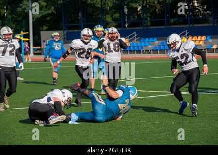 Kiev Ukraine, 15 August 2021, Players in sports uniforms on the field of playing American football. Ukrainian Championship Lvov Lions vs Kiev Capitals Stock Photo