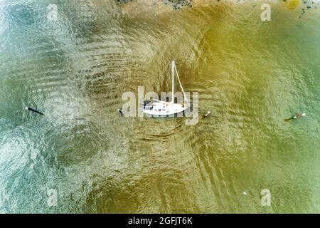 Yachtwreck in marina of small fishing village Brooklyn on Hawkesbury river in Greater Sydney, Australia. Aerial top down view. Stock Photo