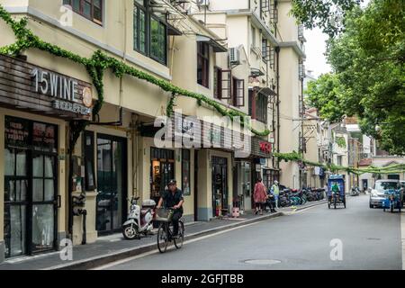 Shanghai, Shanghai, China. 26th Aug, 2021. On August 26, 2021, on both sides of Jiangyin Road in Huangpu District, Shanghai, there are mostly two-story Shikumen Lane houses. There are a lot of green vines along the outer wall of the street, which is nothing special at first glance. Observing carefully, these green leaves are actually simulated leaves with some wires that cannot be hidden inside. Compared with the black wires, this decoration looks much more beautiful. Visual pollution of various overhead lines in old communities is often difficult to deal with. However, in the blocks of Stock Photo