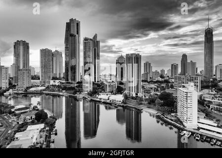 Cloudy black-whtie cityscape of high-rise towers in Surfers paradise city of Australian Gold Coast - aerial view to Pacific ocean from Nerang river. Stock Photo