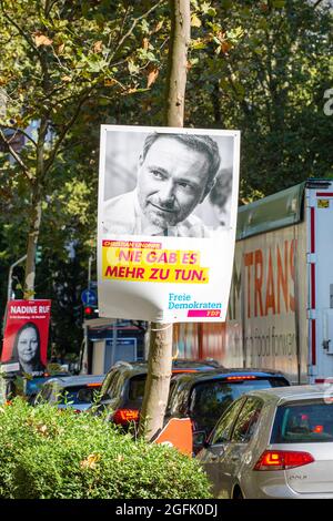 Wiesbaden, Germany - August 25, 2021: Election campaign billboard of the German Freie Demokratische Partei (FDP) in the city center of Wiesbaden, Hessen. Germany faces federal elections on September 26. The Free Democratic Party (German: Freie Demokratische Partei, FDP) is a classical-liberal political party in Germany. The FDP is led by Christian Lindner. Some road users in the background