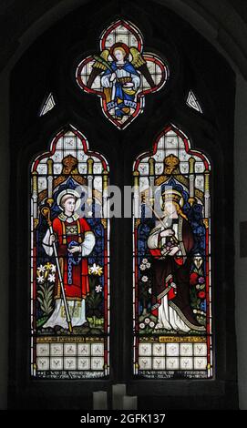 A stained glass window depicting Ss Leonard and Elizabeth of Hungary by Heaton Butler & Bayne, St Leonard's Rockingham, Northamptonshire Stock Photo