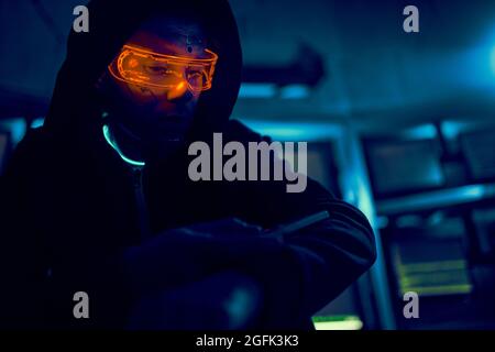 Cyber hacker breaks into databases to obtain information using a computer. Cybercrime and data security concept. Stock Photo
