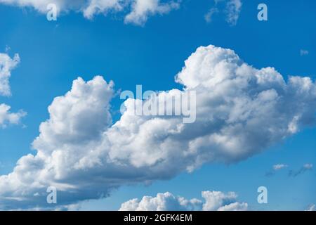 Small clouds on the blue sky. Cloudscape at day time. Stock Photo