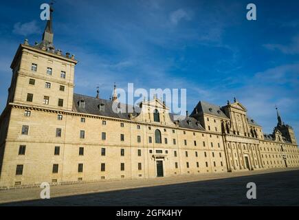 Side perspective view of the main façade and entrance of the monasteries of San Lorenzo de el Escorial, in the Herrerian style, in the community of Ma Stock Photo