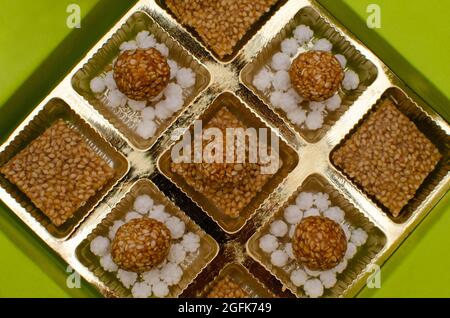 Ladoos and sweets made of sesame and jaggery for Makar Sakranti  festival which marks the transition of Sun in Makar or Capricorn Stock Photo