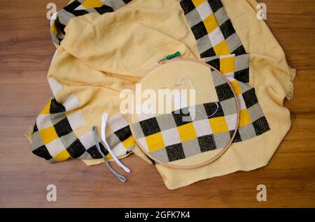 Cross-stitch Design on cloth. Form of counted thread embroidery  Top Angle View, Studio Shot Stock Photo
