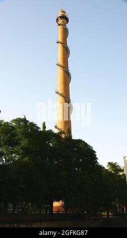 Ornamental industrial chimney in a square in Tarrasa, Barcelona, Catalonia, Spain, Europe Stock Photo