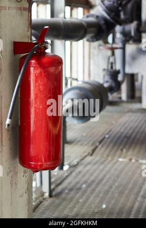 Fire extinguisher security guard equipment in factory for fire protection system. Carbon dioxide fire extinguisher with pressure gauge in industrial Stock Photo
