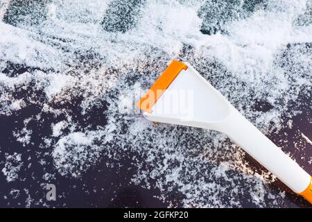 Scraper for cleaning ice from car windows Stock Photo