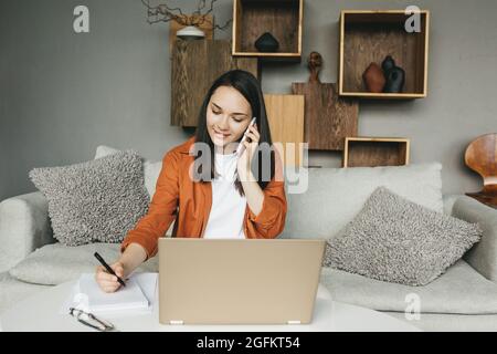 The student studies at home, programs or works as a freelancer.  Stock Photo