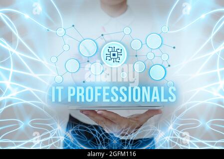 Sign displaying It Professionals. Word Written on any person associatedand expert with the computer world Lady In Uniform Standing Holding Tablet Stock Photo