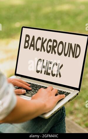 Hand writing sign Background Check. Word for investigation into a person s is origins and previous history Online Jobs And Working Remotely Connecting Stock Photo