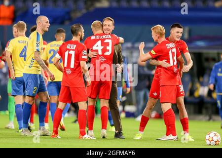 Broendby, Denmark. 25th Aug, 2021. Rasmus Kristensen (43) of FC Red Bull Salzburg celebrate the victory with head coach Matthias Jaissle after the UEFA Champions League qualification match between Broendby IF and FC Red Bull Salzburg at Broendby Stadion in Broendby. (Photo Credit: Gonzales Photo/Alamy Live News Stock Photo