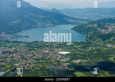 Aerial view of the Caldonazzo Lake and Caldonazzo village in Italian Alps, Valsugana or Sugana valley, Trento province, Trentino-Alto Adige, Italy, Eu Stock Photo