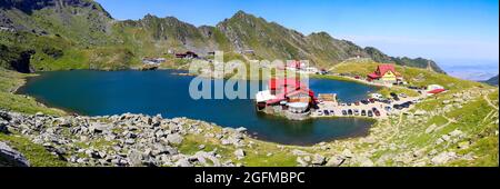 Romania: Lake Balea (Romanian: Balea Lac) from above. The lake is located at the top of the pass on the Transfagaras High Road in the Fagaras Mountain Stock Photo