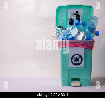 basra, iraq - august 22, 2021: Photo of plastic bottles in a plastic trash bin Stock Photo