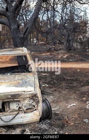 Burned car after the devastating bushfires at Mount Parnitha, in Attica ...