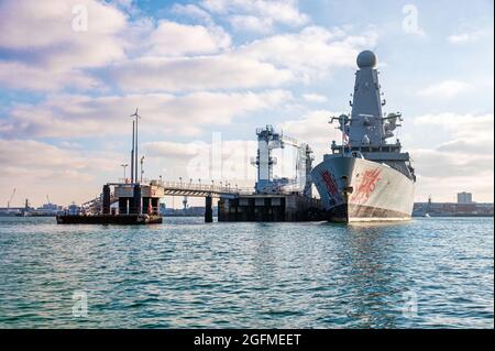 HMS Dragon (D35), one of six Type 45 destroyers operated by the Royal Navy at the ammunitioning facility in Portsmouth Harbour. Stock Photo