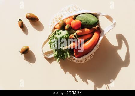 Fresh Avocado in eco bag for fruits and vegetables Stock Photo - Alamy