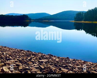 Cooper Lake, NY, the largest natural lake in the Catskills at 50% of its capacity due to drought Stock Photo