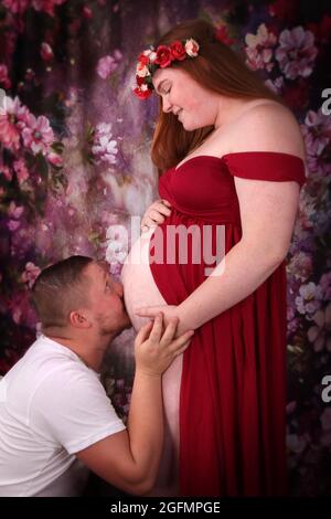 pregnancy. Maternity preparation. life birth expectation. Love. beautiful  pregnant woman in spring flower skirt. womens health. girl with big belly  Stock Photo - Alamy