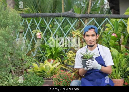 Man sell plant garden in shop Stock Photo