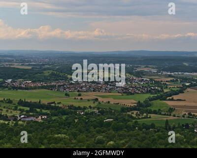 Aerial view of landscape with small village Nabern, part of Kirchheim unter Teck, Baden-Württemberg, Germany, surrounded by agricultural fields. Stock Photo