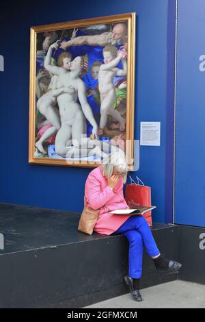 London, UK. 26th Aug, 2021. A woman blends in to the artwork and background at ´Nation´s Favourite Paintings´ on Trafalgar Square, which features 20 life-sized replicas of the Nation's Favourite Paintings and free community art sessions, the exhibits are in place until 31st August. Credit: Imageplotter/Alamy Live News Stock Photo