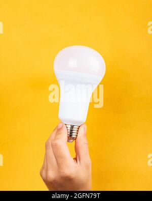 Finance Concept: Light Bulb On Computer Keyboard Background Stock Photo 