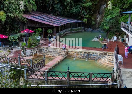 FUENTES GEORGINAS, GUATEMALA - MARCH 22, 2016: People bathing in a thermal pool Funtes Georginas. Stock Photo