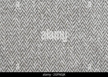Full frame grey and white textured herringbone furnishing or fashion fabric Stock Photo