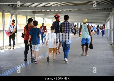 salvador, bahia, brazil - august 12, 2021: People are seen transiting a pedestrian walkway to access the subway station in the city of Salvador. Stock Photo