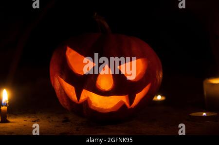 pumpkin head with candles in the dark on halloween night Stock Photo