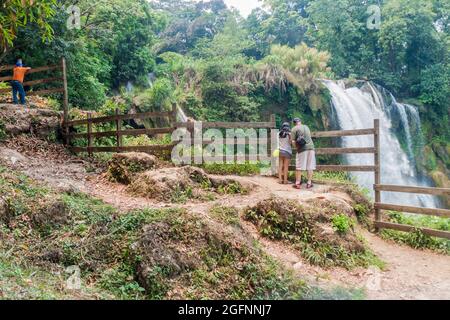 PULHAPANZAK, HONDURAS - APRIL 18, 2016 Tourists observe Pulhapanzak waterfall Stock Photo