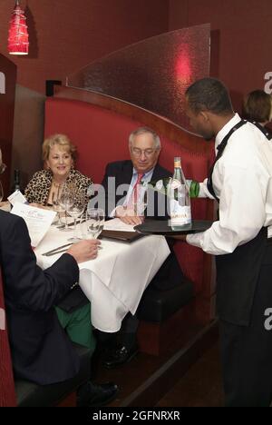 SAINT LOUIS, UNITED STATES - Jul 02, 2009: A vertical shot of a people dining at an upscale restaurant in St. Louis, Missouri Stock Photo