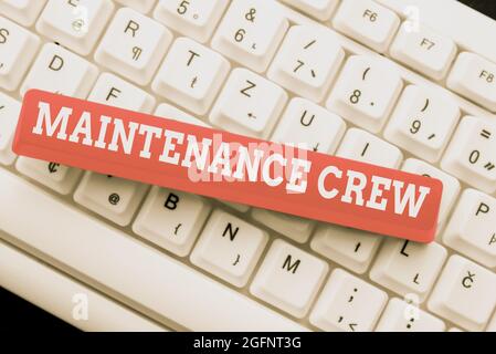 Hand writing sign Maintenance Crew. Word Written on responsible for maintenance and repair work of buildings Typing Program Code Script, Abstract Stock Photo