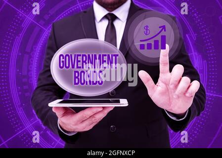 Text sign showing Government Bonds. Business overview debt security issued by a government to support spending Man In Office Uniform Standing Pressing Stock Photo