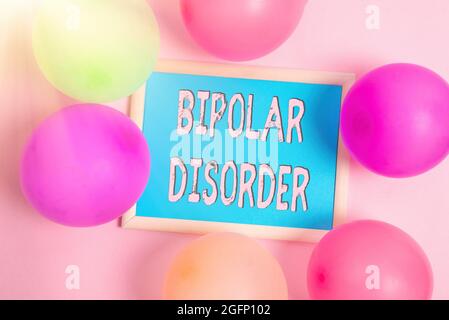 Hand writing sign Bipolar Disorder. Conceptual photo mental illness that brings severe high and low moods Colorful Party Invitation Designs Bright Stock Photo