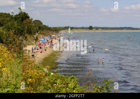 Knoll Beach, Shell Bay, Studland, Purbeck, Dorset, UK packed with holidaymakers in August, summer Stock Photo