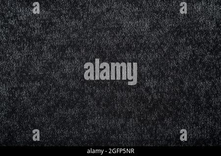 Cloth. The background is made of dark colored fabric. A texture or pattern from a material. A piece of fabric for the work of a designer, fashion desi Stock Photo
