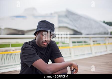 Closeup shot of an afro-American man posing outside in France Stock Photo
