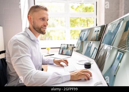 Security Camera CCTV Surveillance. Disabled Workers In Wheelchair Stock Photo