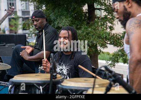 Washington, Dc, USA. 26th Aug, 2021. Activists play music as part of a protest of the voter suppression of Black Americans outside the U.S. Chamber of Commerce in Washington, DC on August 26, 2021. (Photo by Matthew Rodier/Sipa USA) Credit: Sipa USA/Alamy Live News Stock Photo