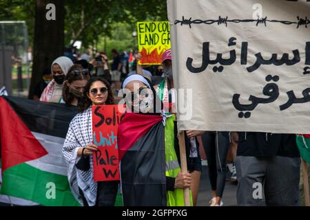 Washington, USA. 26th Aug, 2021. An activist with a sign leads pro-Palestinian activists protesting a visit to the White House by Israel's Prime Minister in Washington, DC on August 26, 2021. (Photo by Matthew Rodier/Sipa USA) Credit: Sipa USA/Alamy Live News Stock Photo