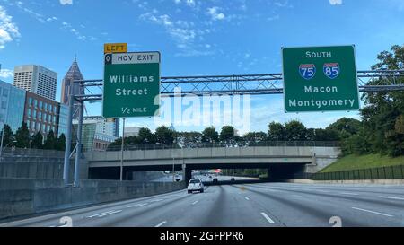 Atlanta, GA USA - May 25, 2021:  The Atlanta, Georgia skyline with road signs, condominiums and office buildings. Stock Photo