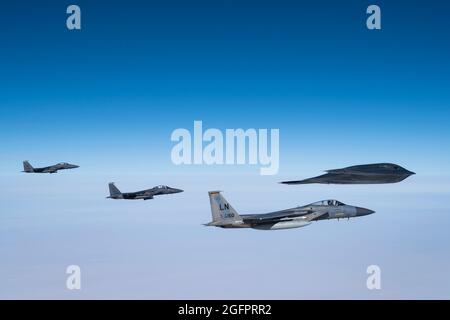 North Sea, UK. 25th Aug, 2021. A U.S. Air Force B-2 Spirit Stealth bomber, from the 509th Bomb Wing is escorted by F-15C Eagle, and F-15E Strike Eagles fighter aircraft, assigned to the 493rd Fighter Squadron, during a training sortie over the North Sea August 25, 2021 off the coast of Scotland. Credit: Planetpix/Alamy Live News Stock Photo